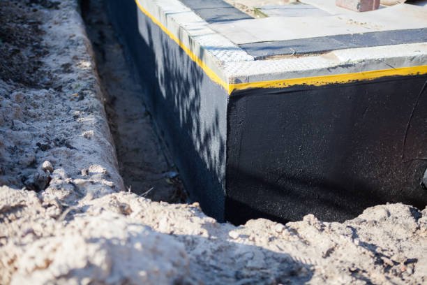Professional Waterproofing technician working in Brownsville, KY
